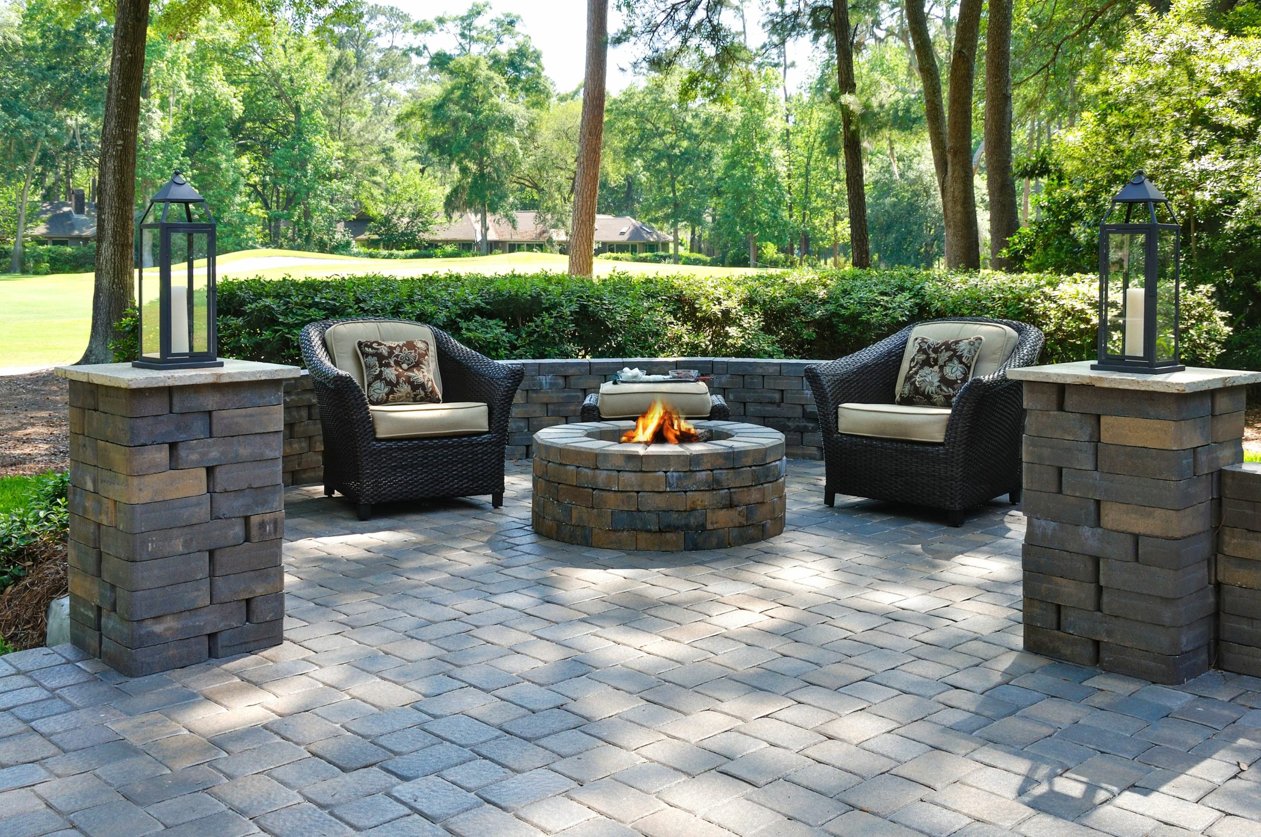 Beautiful outdoors pavers with two comfortable armchairs and a f
